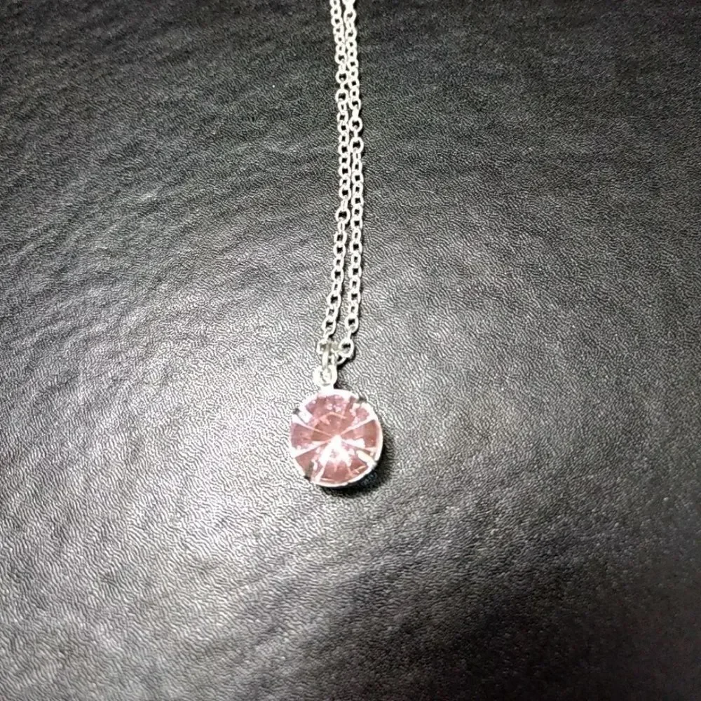Silver tone and pink stone necklace